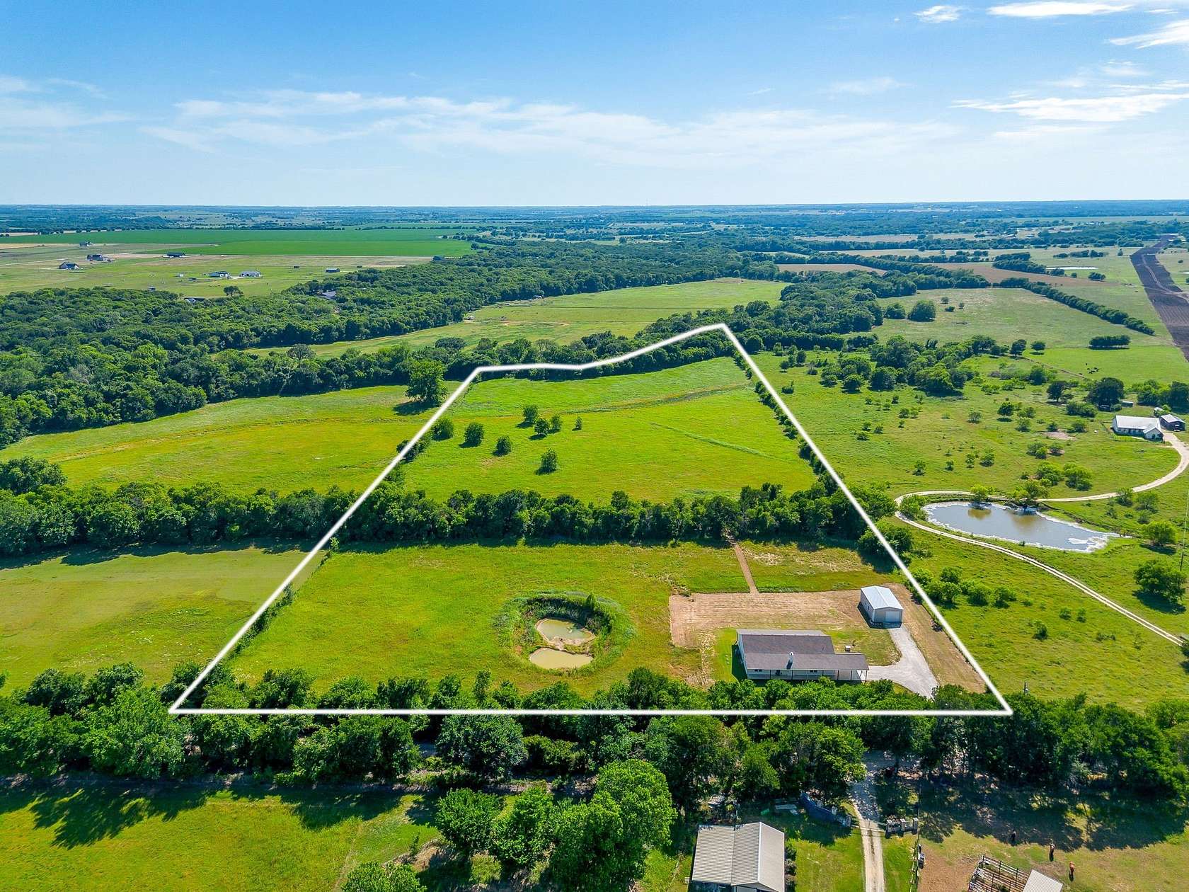 19.2 Acres of Land with Home for Sale in Grandview, Texas