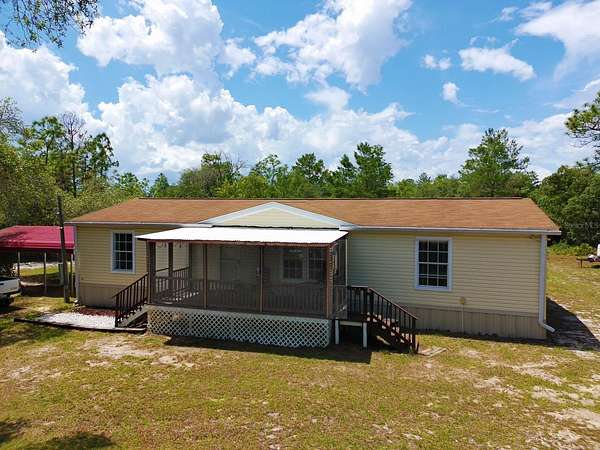 2.62 Acres of Land with Home for Sale in Dunnellon, Florida