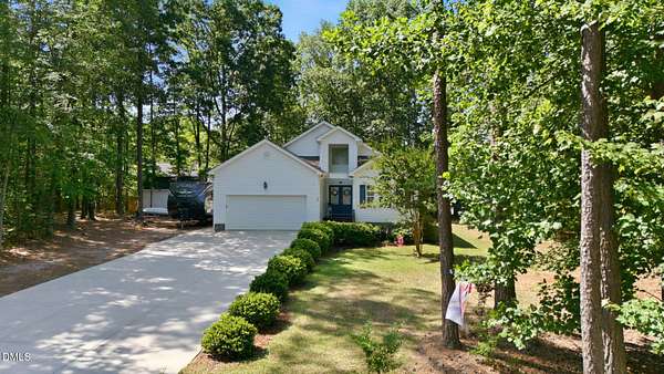 1.5 Acres of Land with Home for Sale in Louisburg, North Carolina