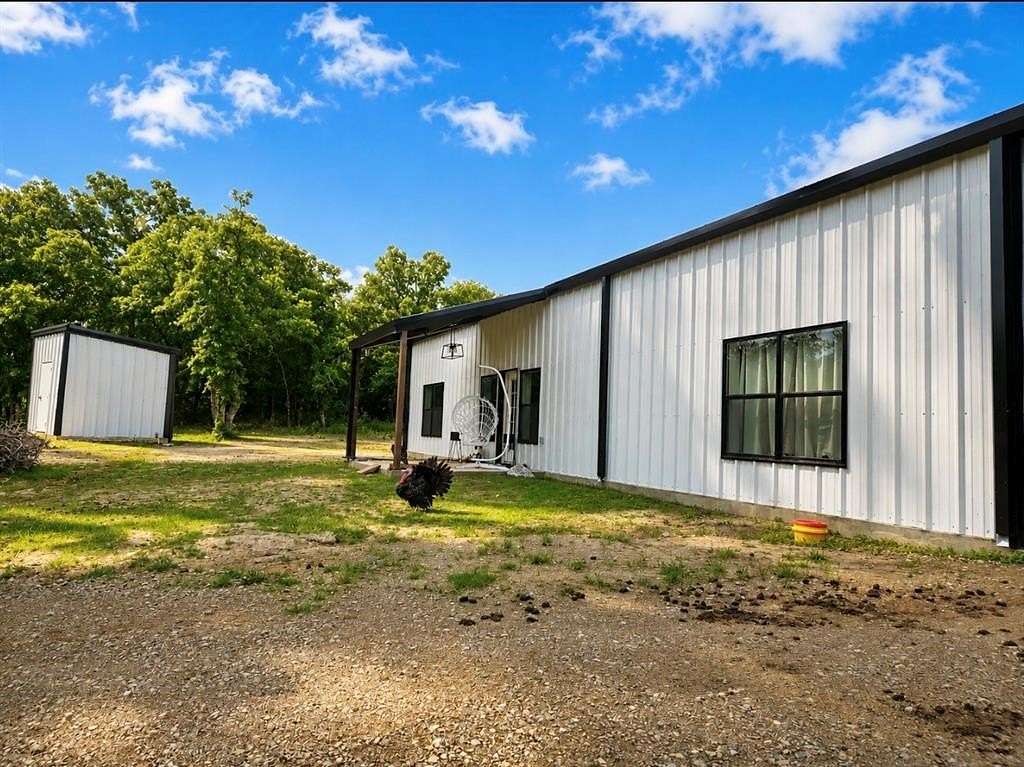 10.9 Acres of Land with Home for Sale in Poolville, Texas