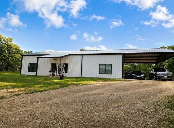 10.9 Acres of Land with Home for Sale in Poolville, Texas