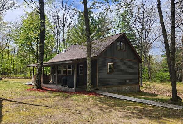20 Acres of Recreational Land with Home for Sale in Chase, Michigan