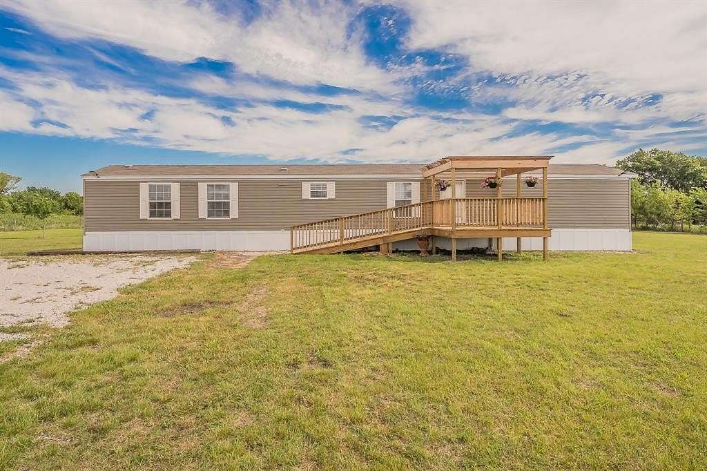 5 Acres of Land with Home for Sale in Justin, Texas