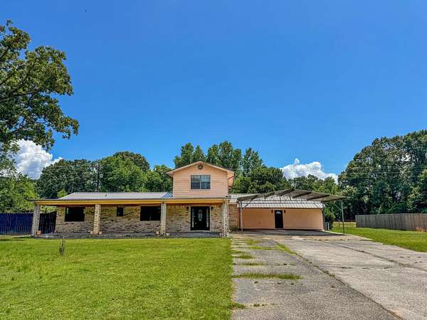 3.49 Acres of Land with Home for Sale in Avinger, Texas
