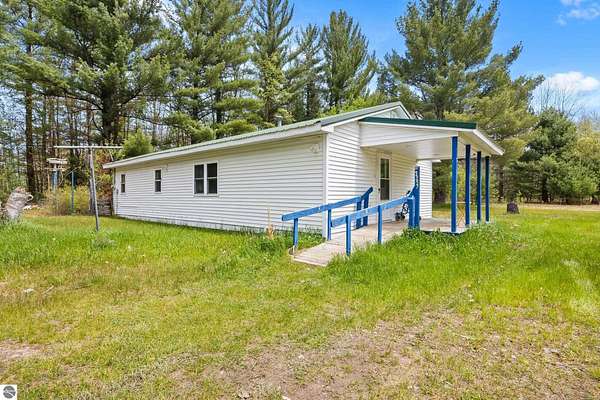 5 Acres of Land with Home for Sale in South Boardman, Michigan