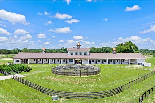 80 Acres of Agricultural Land with Home for Sale in Citra, Florida