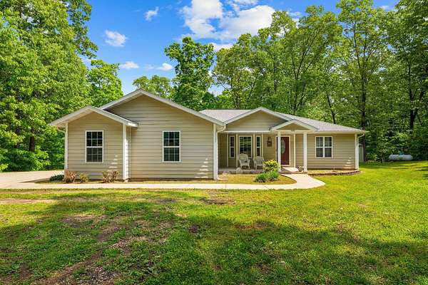 6.4 Acres of Land with Home for Sale in Reeds Spring, Missouri