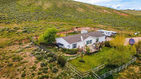26.5 Acres of Land with Home for Sale in Bear River, Wyoming