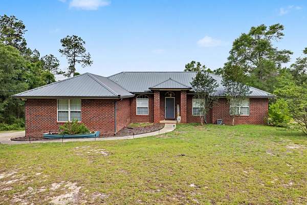 3.85 Acres of Land with Home for Sale in Baker, Florida