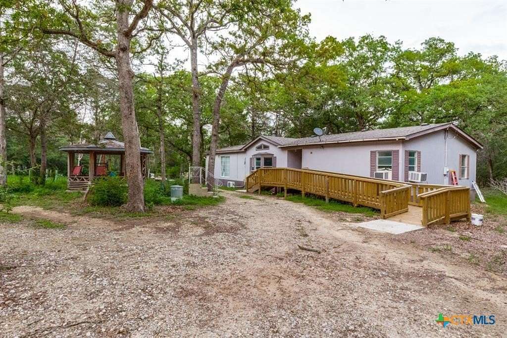 5.38 Acres of Land with Home for Sale in Bastrop, Texas