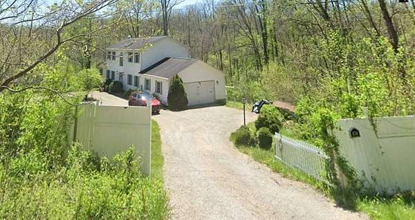4.74 Acres of Land with Home for Auction in Blue Rock, Ohio