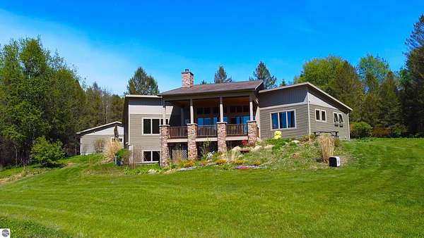10.5 Acres of Recreational Land with Home for Sale in Maple City, Michigan