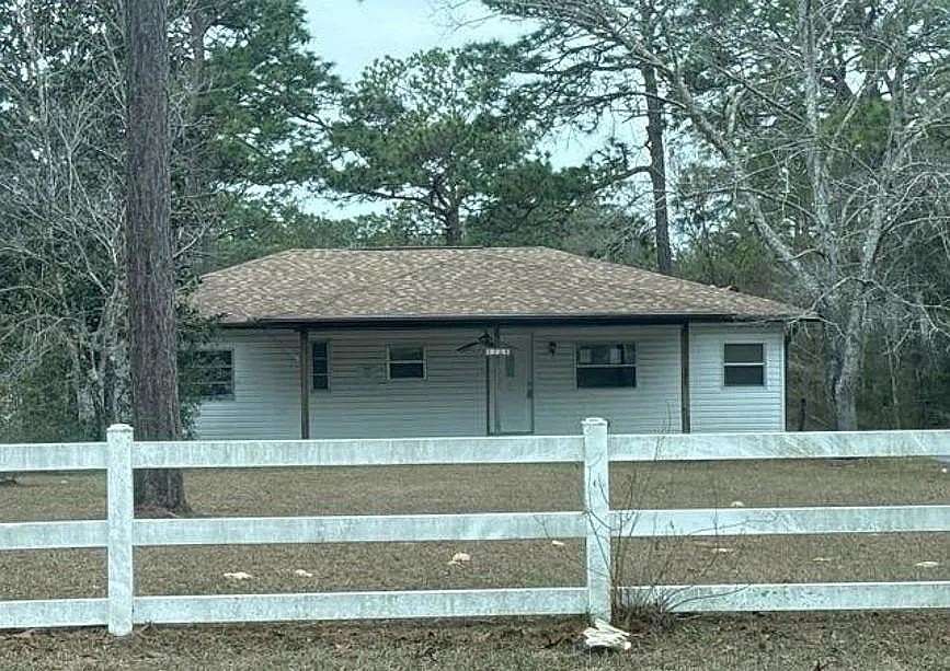 2.42 Acres of Land with Home for Auction in Homosassa Springs, Florida