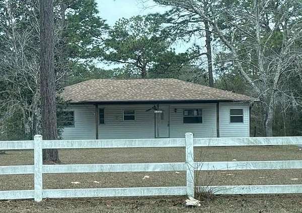 2.42 Acres of Land with Home for Auction in Homosassa Springs, Florida