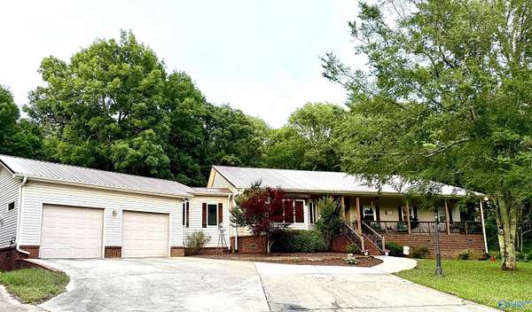 8.8 Acres of Land with Home for Sale in Laceys Spring, Alabama