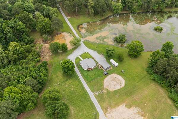 21.9 Acres of Land with Home for Sale in Columbiana, Alabama