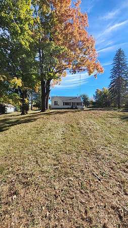 2 Acres of Land with Home for Sale in Comins, Michigan