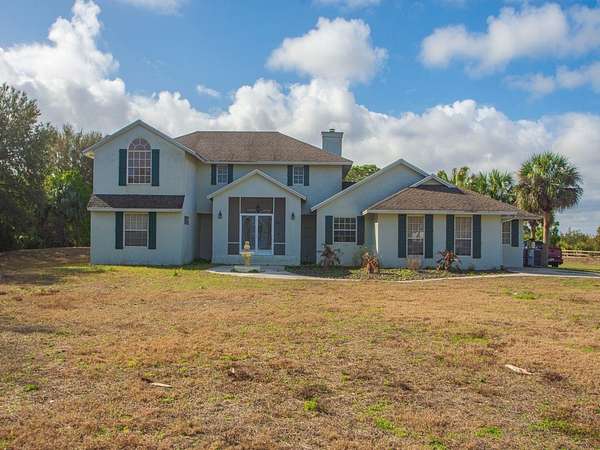 2.5 Acres of Land with Home for Sale in Palm Bay, Florida