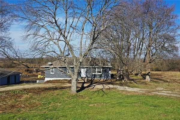 10 Acres of Recreational Land with Home for Sale in Harrisonville, Missouri