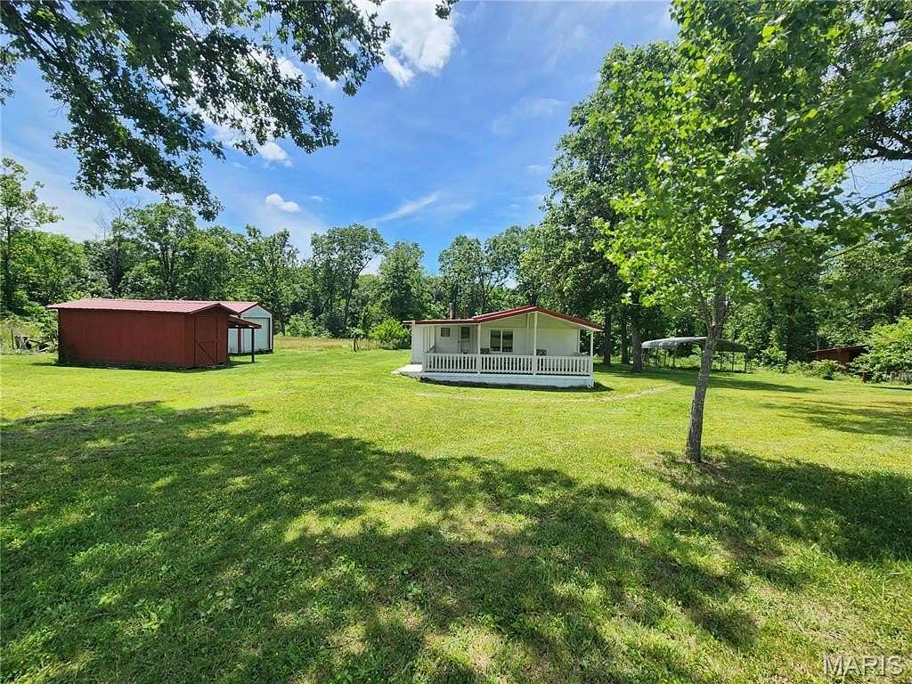 50 Acres of Agricultural Land with Home for Sale in Richland, Missouri
