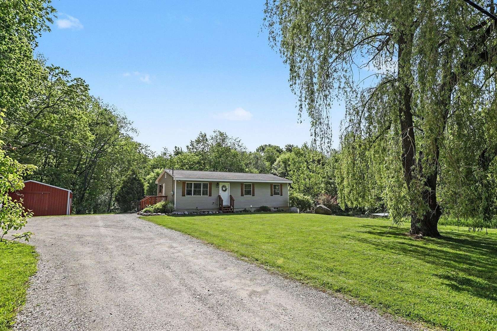 5 Acres of Land with Home for Sale in Alto, Michigan