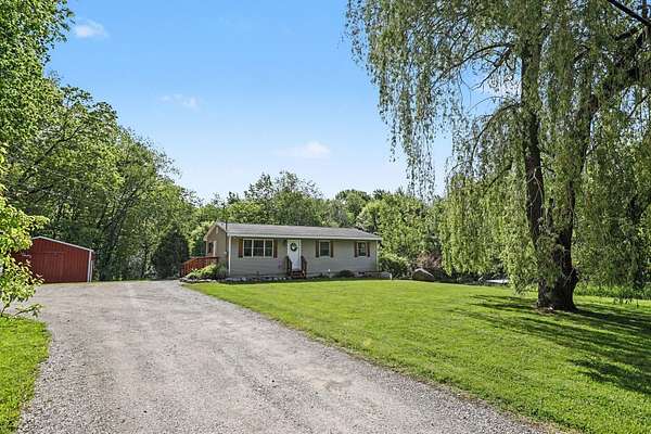 5 Acres of Land with Home for Sale in Alto, Michigan