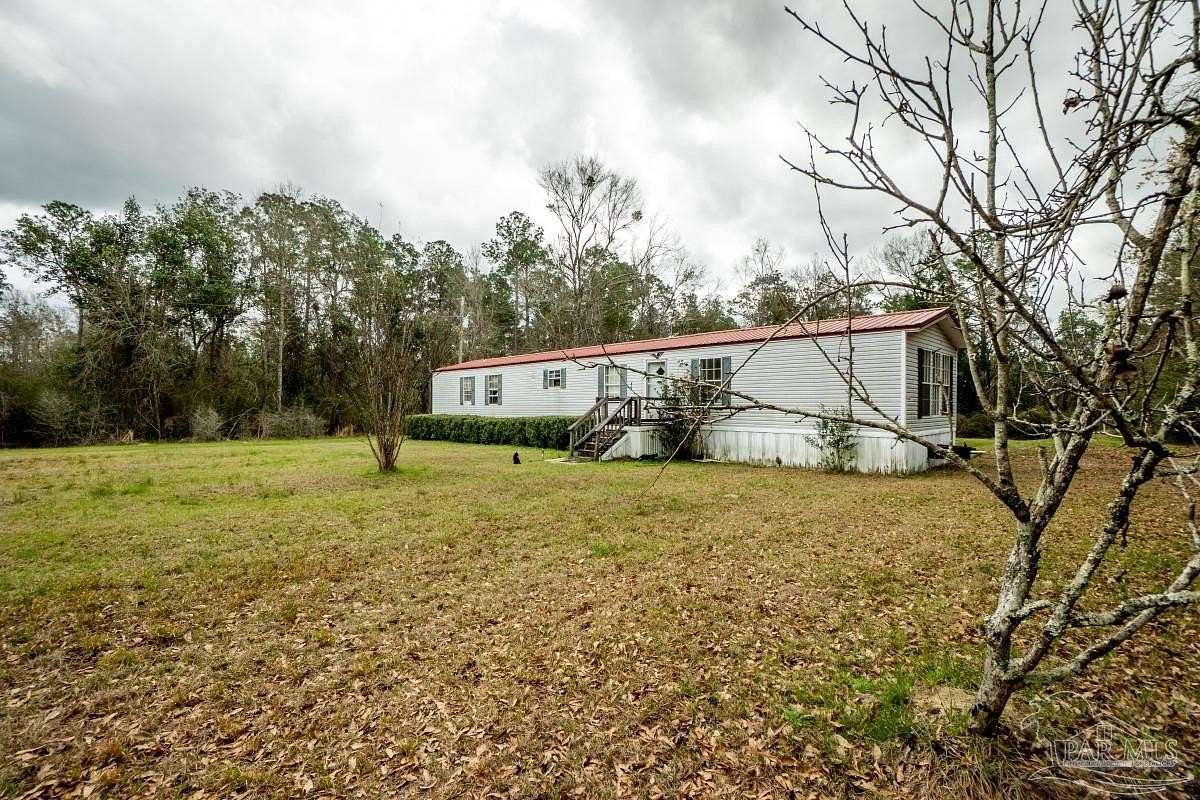 5.4 Acres of Land with Home for Sale in Milton, Florida