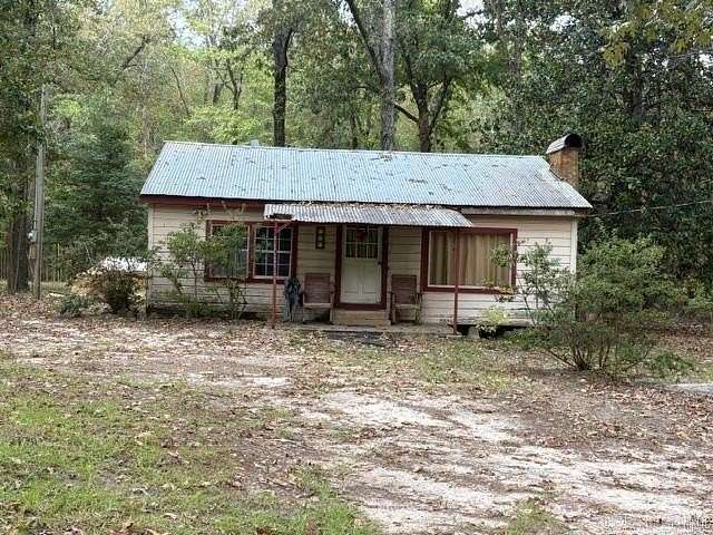 6.69 Acres of Land with Home for Sale in Buckner, Arkansas