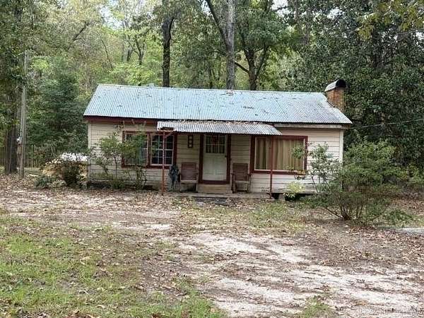 6.69 Acres of Land with Home for Sale in Buckner, Arkansas
