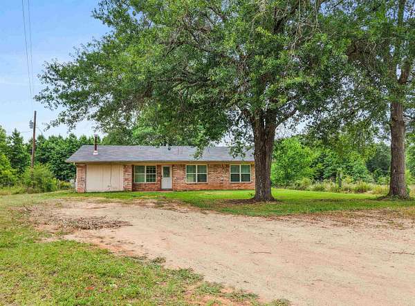 10 Acres of Land with Home for Sale in Hughes Springs, Texas