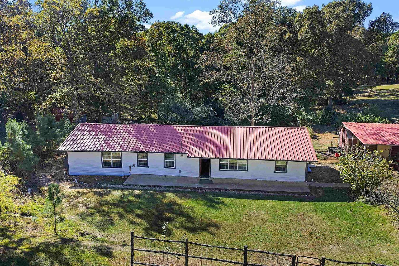 9.37 Acres of Land with Home for Sale in Avinger, Texas