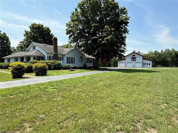8.74 Acres of Land with Home for Sale in East Bend, North Carolina