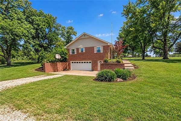 5.62 Acres of Land with Home for Sale in Elm Springs, Arkansas