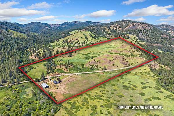 80 Acres of Agricultural Land with Home for Sale in Inchelium, Washington