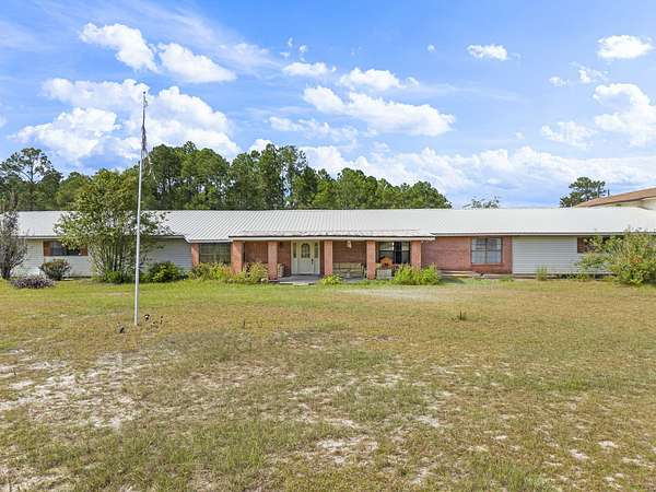 5.25 Acres of Land with Home for Sale in Freeport, Florida