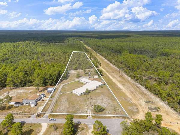 5.25 Acres of Land with Home for Sale in Freeport, Florida
