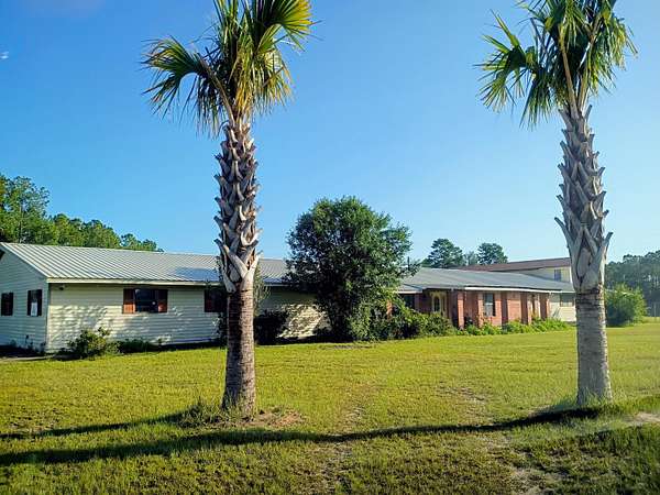 5.25 Acres of Land with Home for Sale in Freeport, Florida