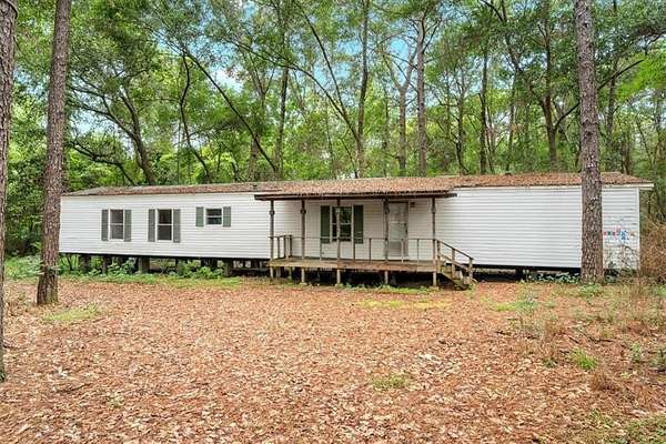 4.42 Acres of Land with Home for Sale in Grand Bay, Alabama