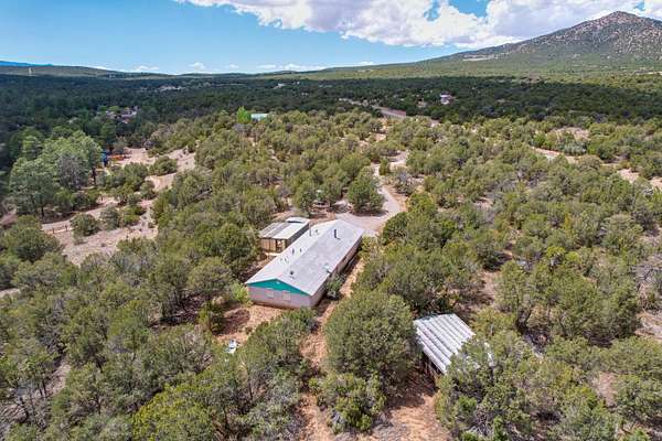 24.8 Acres of Recreational Land with Home for Sale in Golden, New Mexico