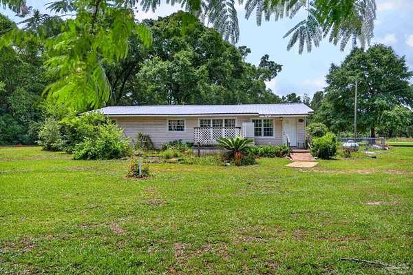1.52 Acres of Land with Home for Sale in Milton, Florida