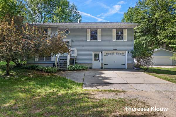 5 Acres of Land with Home for Sale in Fruitport, Michigan