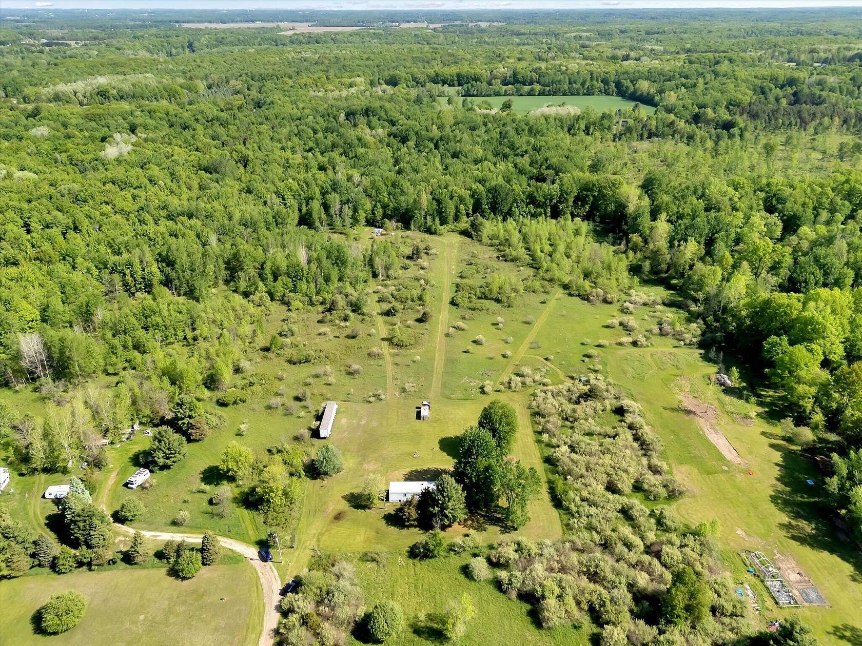 10 Acres of Recreational Land with Home for Sale in Grant, Michigan