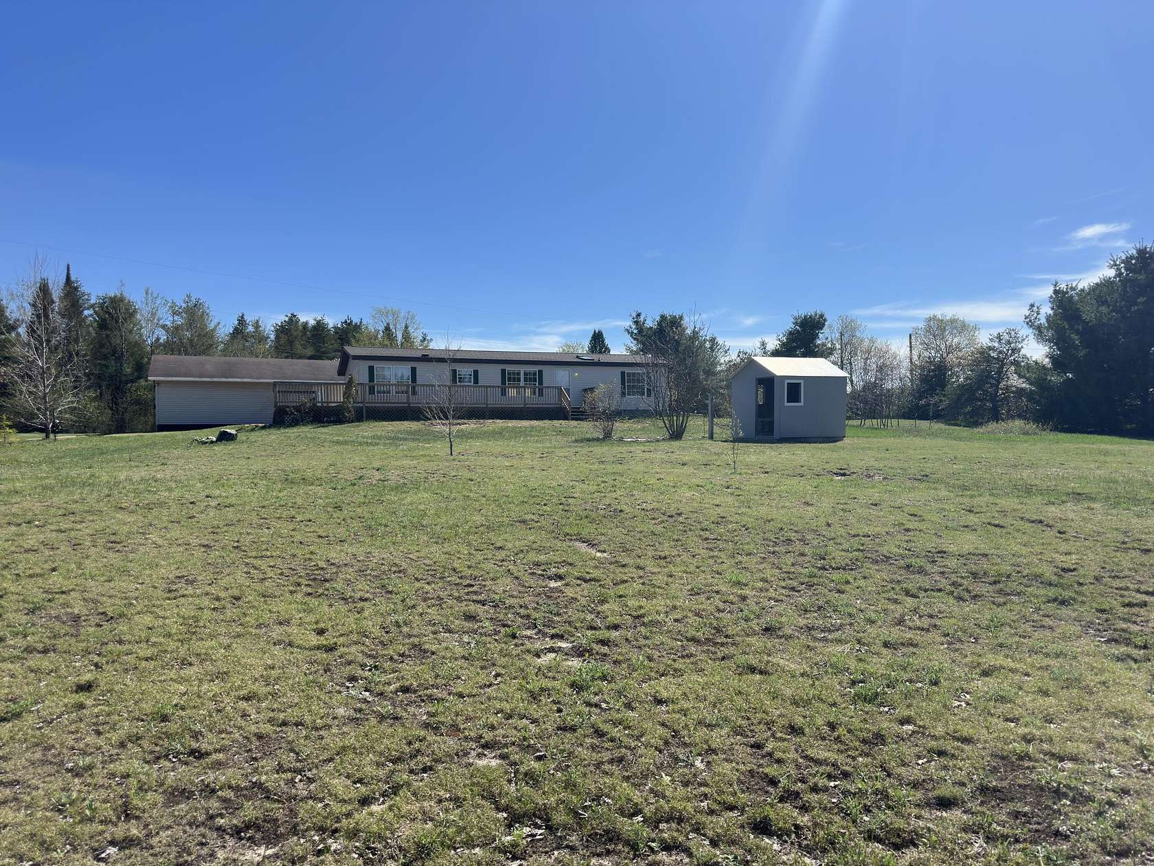 10 Acres of Land with Home for Sale in Strongs, Michigan