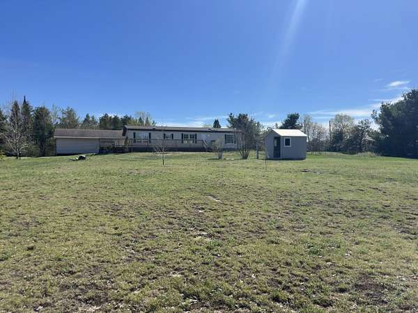10 Acres of Land with Home for Sale in Strongs, Michigan