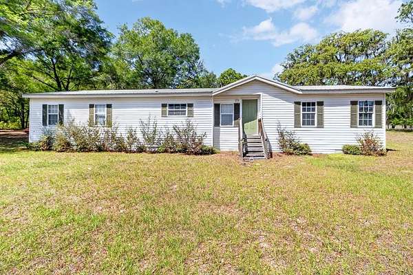 8.79 Acres of Land with Home for Sale in High Springs, Florida