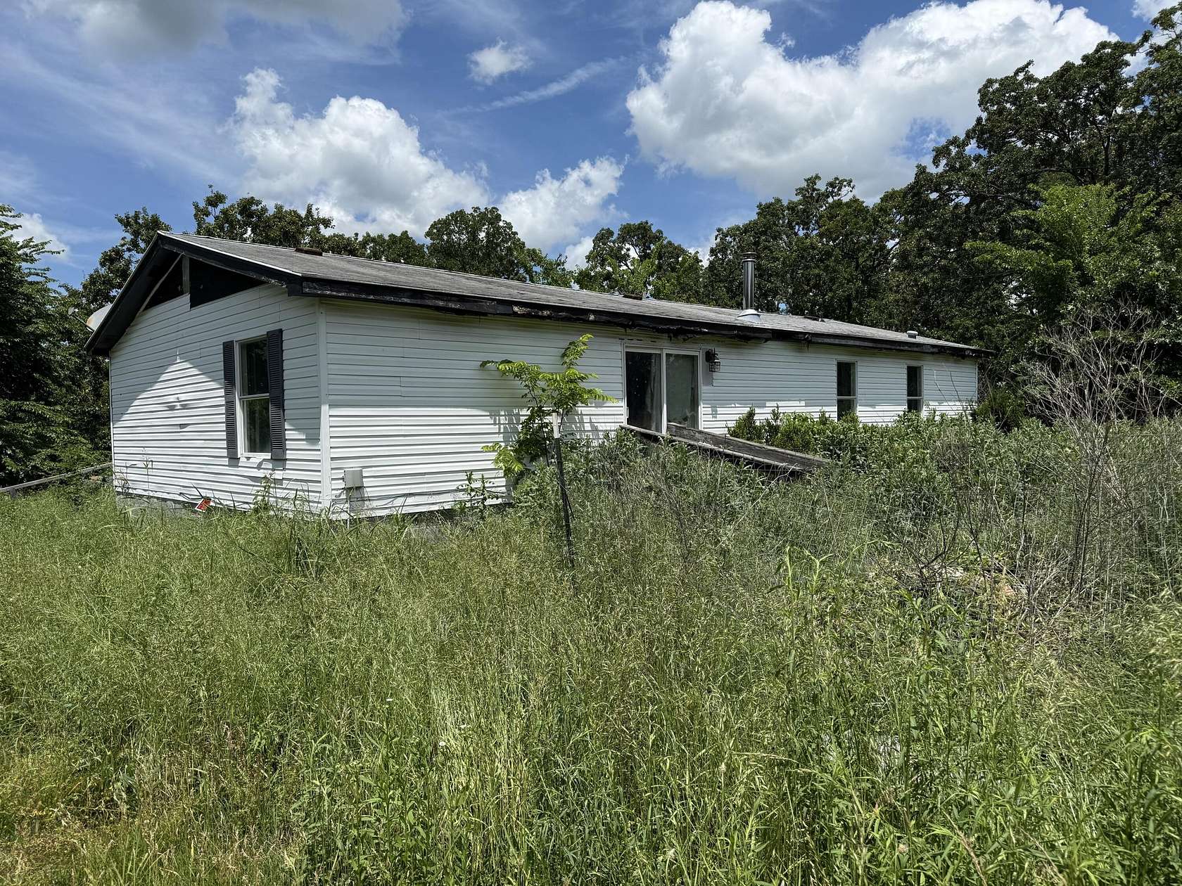 3.38 Acres of Land with Home for Sale in Goodman, Missouri