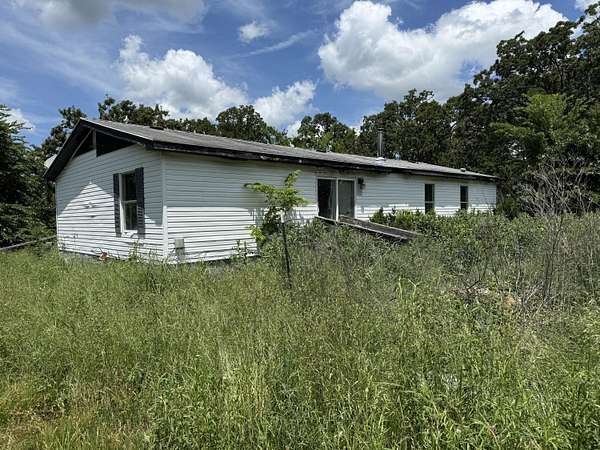 3.38 Acres of Land with Home for Sale in Goodman, Missouri