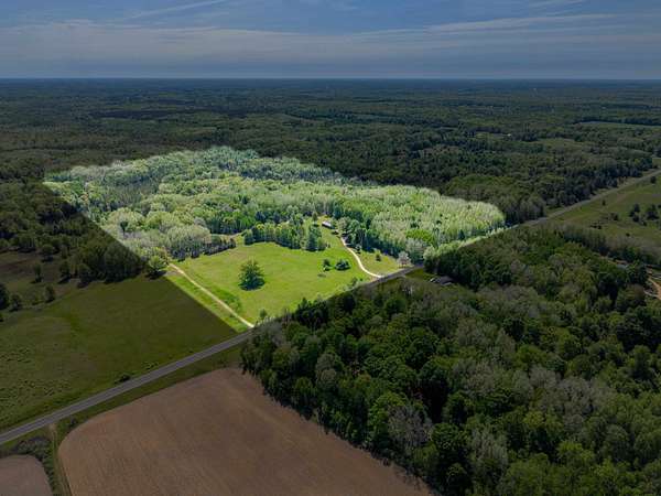 59.4 Acres of Recreational Land with Home for Sale in Harrison, Michigan