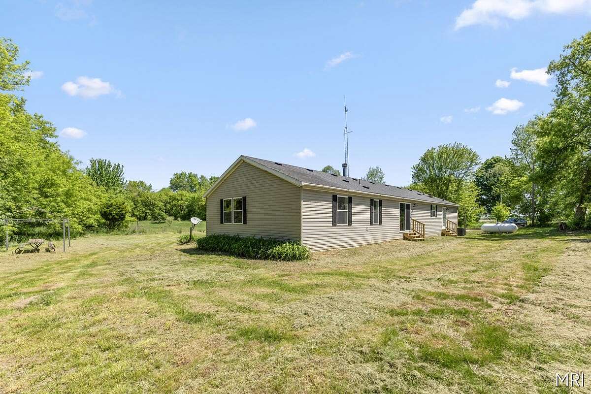 1.75 Acres of Land with Home for Sale in Sheridan, Michigan