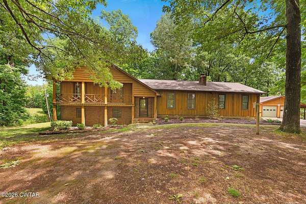 7.6 Acres of Land with Home for Sale in Beech Bluff, Tennessee
